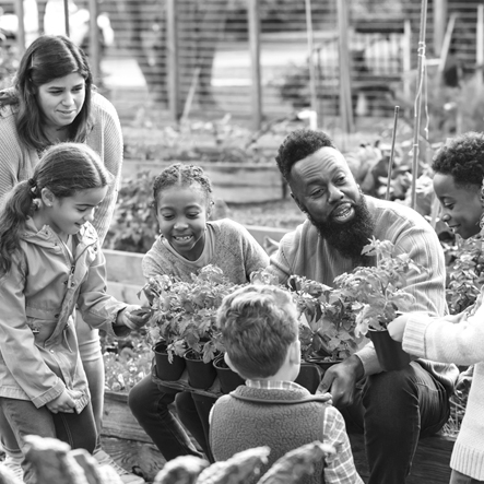 A group of children learning about gardening