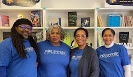 Blue Cross volunteers smile at an event.