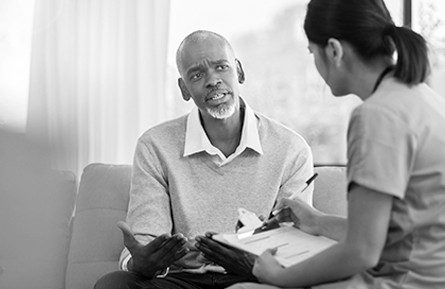 A man having a conversation with a health care provider