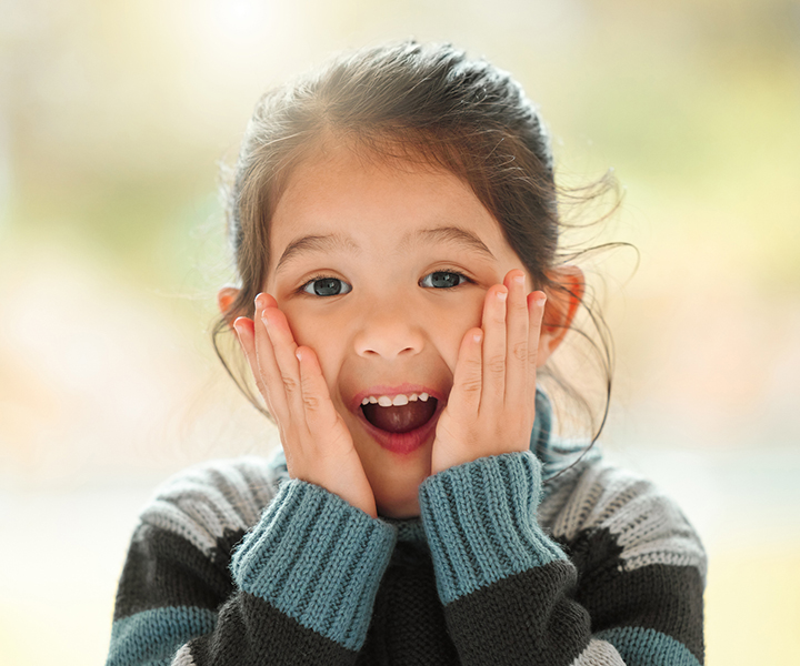 Young girl looks surprised
