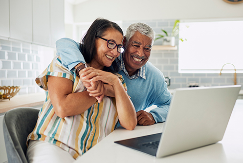 A couple looking at laptop