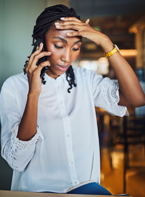 A young person talking on a mobile device