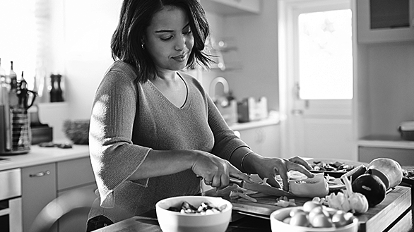 Person cooking in kitchen
