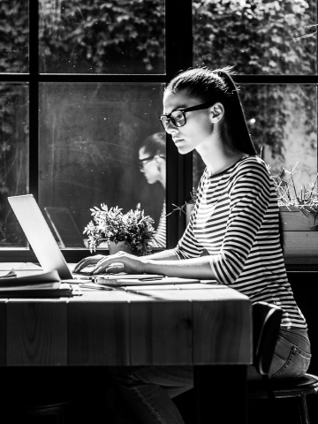 woman types at keyboard