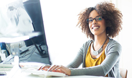 Woman typing on keyboard