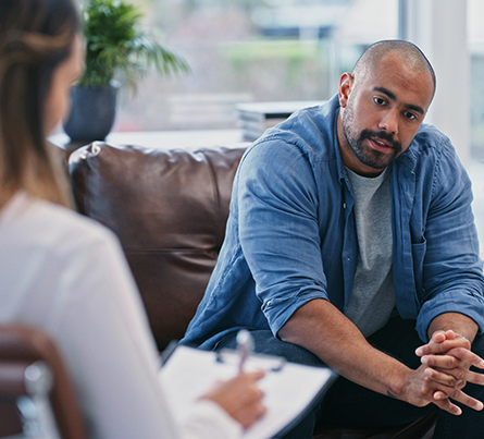 A man speaking with a therapist