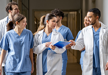 Several health care providers walk and talk