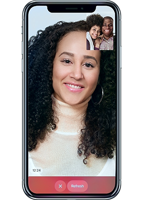 Mobile device showing a video conference between three smiling adults