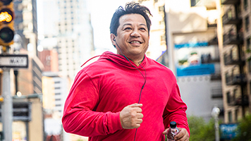 A man jogging in a track suit