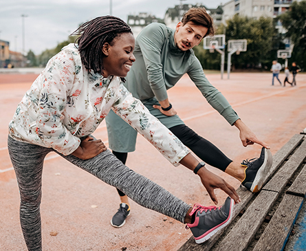 A couple stretching before working out