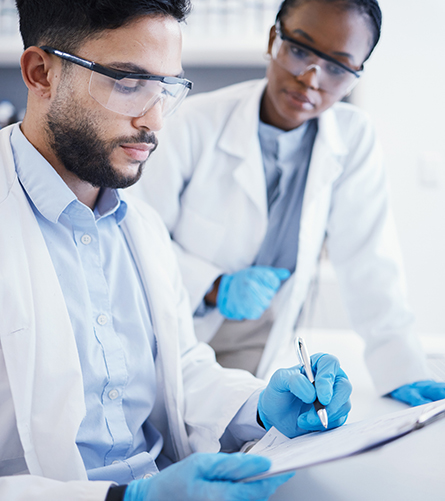 two medical professionals look at some paperwork