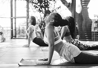Three women do yoga together. 