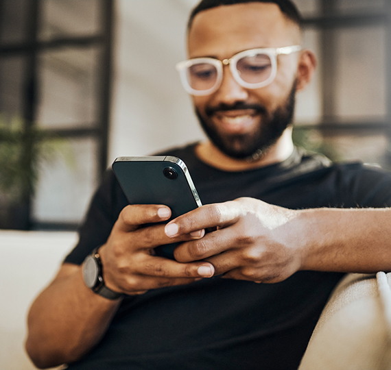 A man texts on his phone