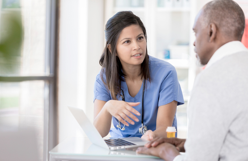 A doctor talks with her patient.