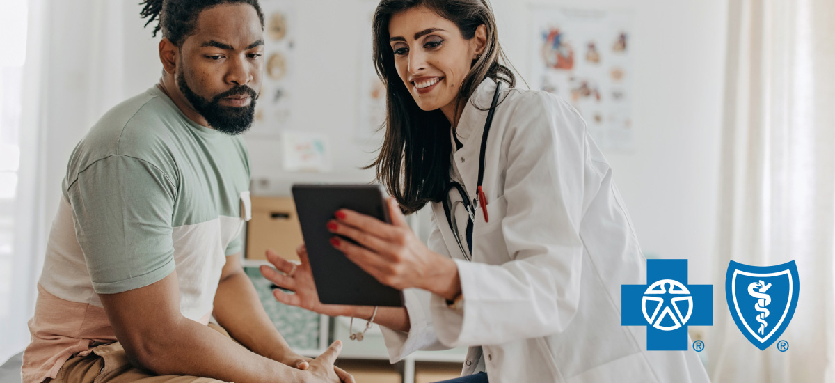 Person reviewing results with doctor on tablet